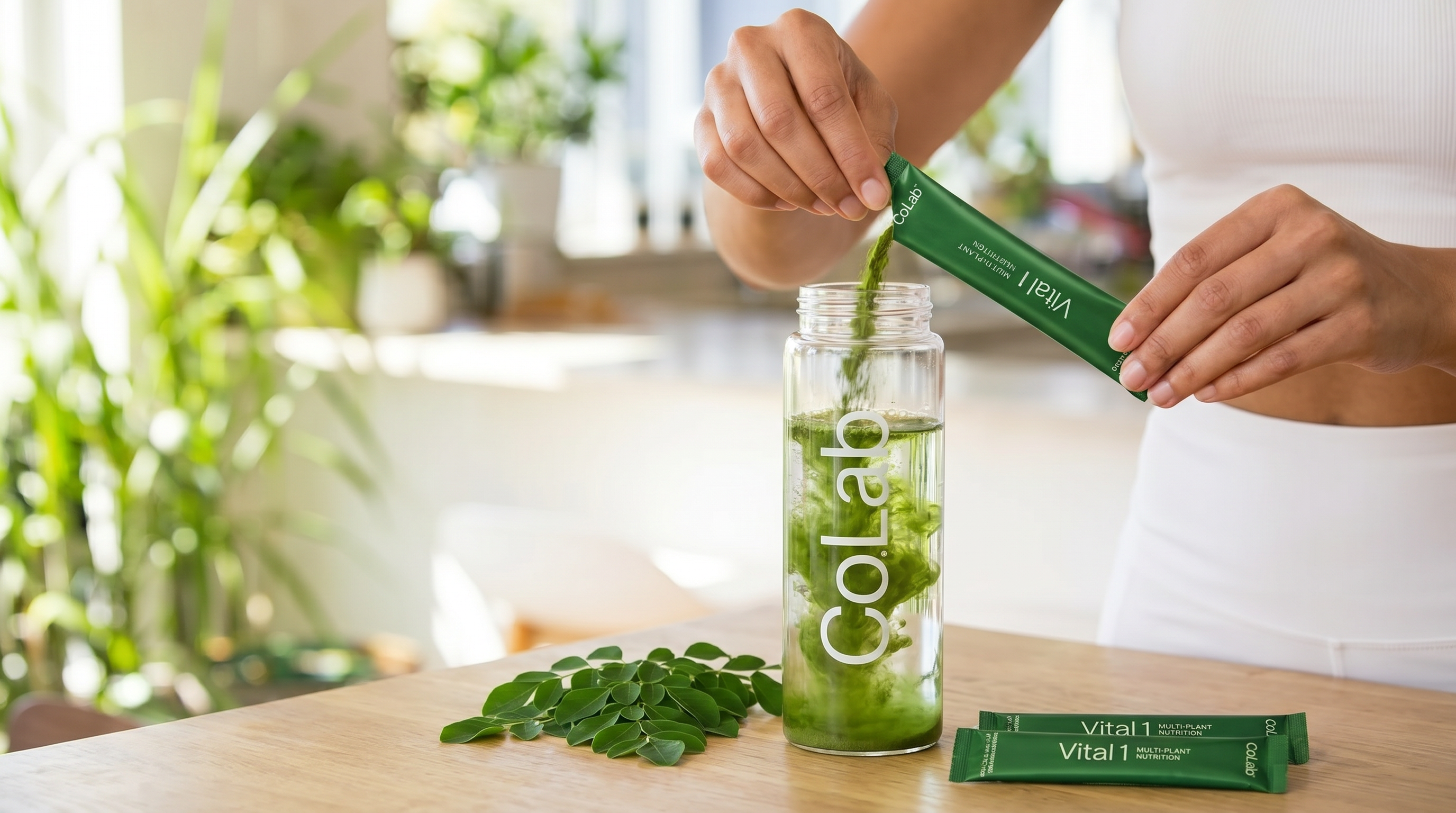 Vital 1 Moringa sachet being mixed into a glass of water